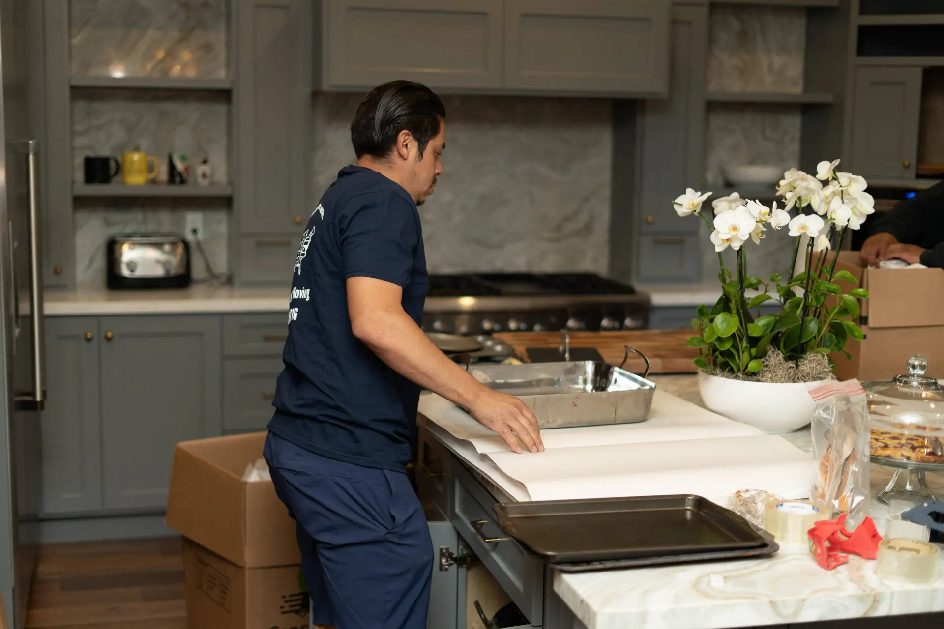 Cross Country Moving team packing kitchen for Austin move